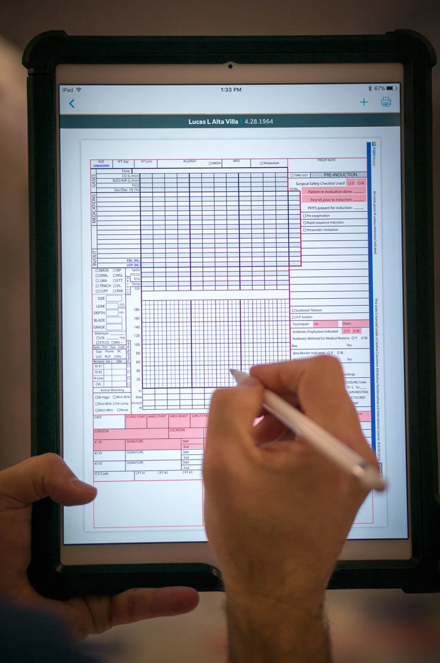 The familiar anesthesia record on an iPad, with a clinician documenting using an Apple Pencil.